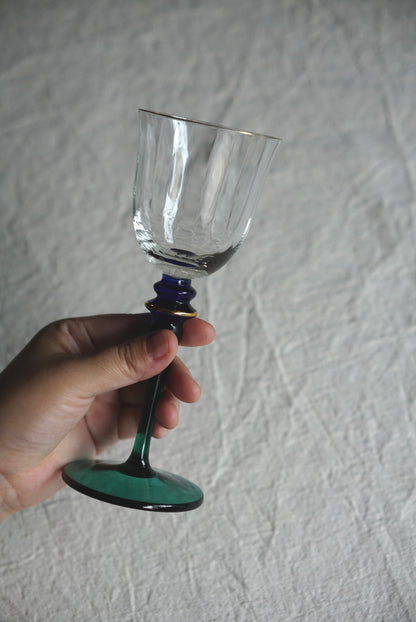 Blue-green used high-stemmed wine glass