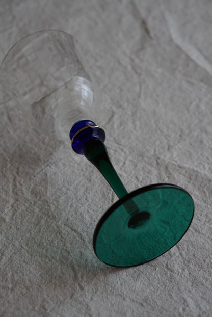 Blue-green used high-stemmed wine glass